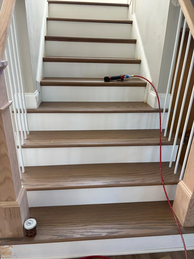 Oak stair treads and white risers part way through installation
